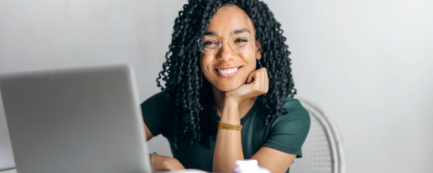  young business woman working with laptop sitting in the office