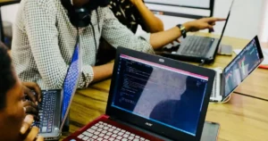 cloud platforms: person using black and red Acer laptop computer on table