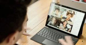 Person in a video call with a diverse team, symbolizing a focus on Diversity, Equity, Inclusion, and Belonging (DEIB) in the workplace.